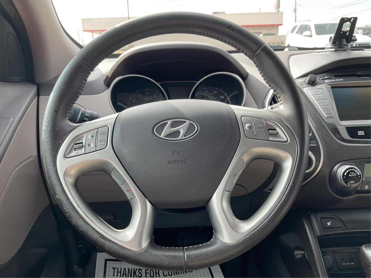 2013 Hyundai Tucson Limited (KM8JU3AC4DU) with an Theta II 2.4L I-4 DOHC engine, located at 1099 N County Rd 25A, Troy, OH, 45373, (937) 908-9800, 40.057079, -84.212883 - Photo#14