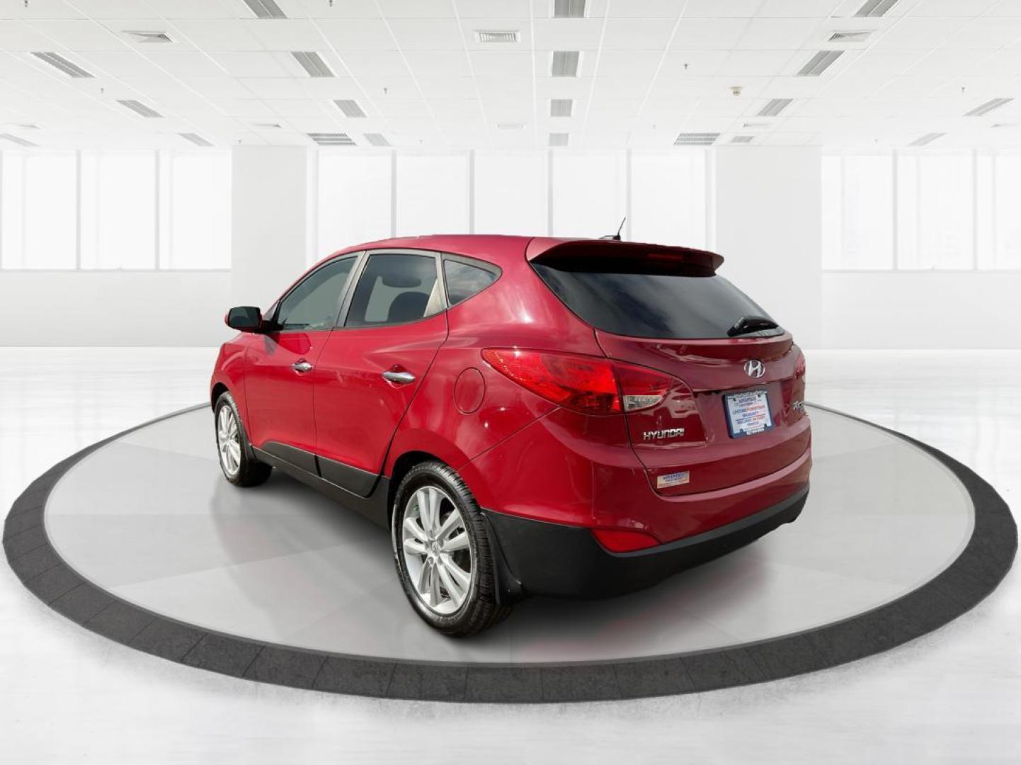 2013 Hyundai Tucson Limited (KM8JU3AC4DU) with an Theta II 2.4L I-4 DOHC engine, located at 1099 N County Rd 25A, Troy, OH, 45373, (937) 908-9800, 40.057079, -84.212883 - Photo#3