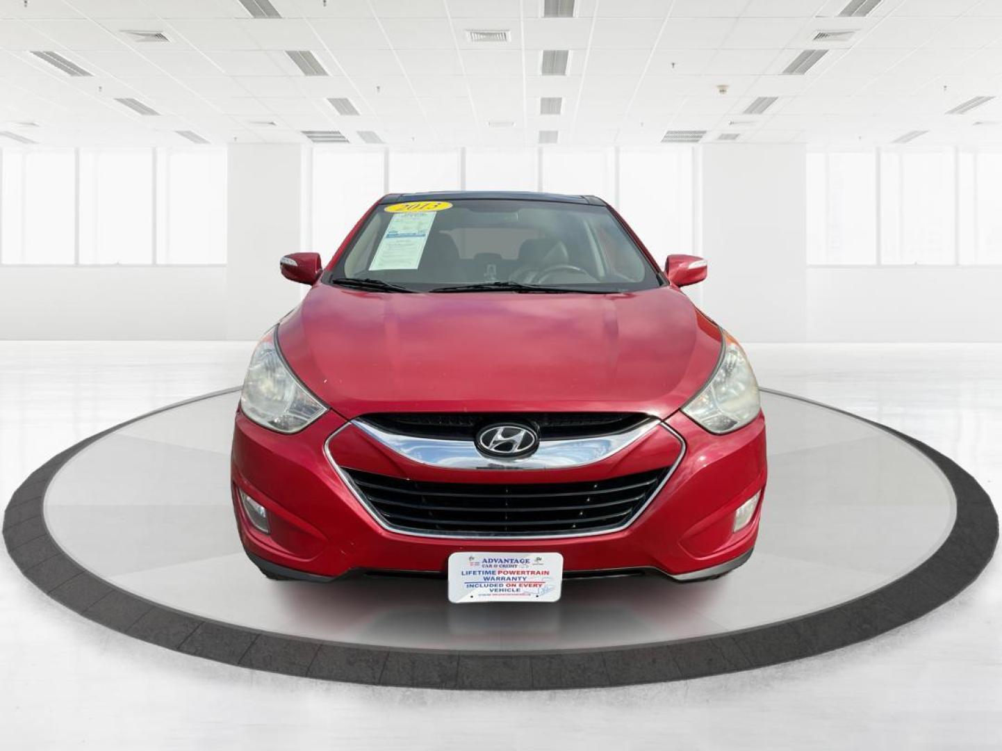 2013 Hyundai Tucson Limited (KM8JU3AC4DU) with an Theta II 2.4L I-4 DOHC engine, located at 1099 N County Rd 25A, Troy, OH, 45373, (937) 908-9800, 40.057079, -84.212883 - Photo#5