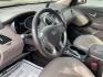 2013 Hyundai Tucson Limited (KM8JU3AC4DU) with an Theta II 2.4L I-4 DOHC engine, located at 1099 N County Rd 25A, Troy, OH, 45373, (937) 908-9800, 40.057079, -84.212883 - Photo#7