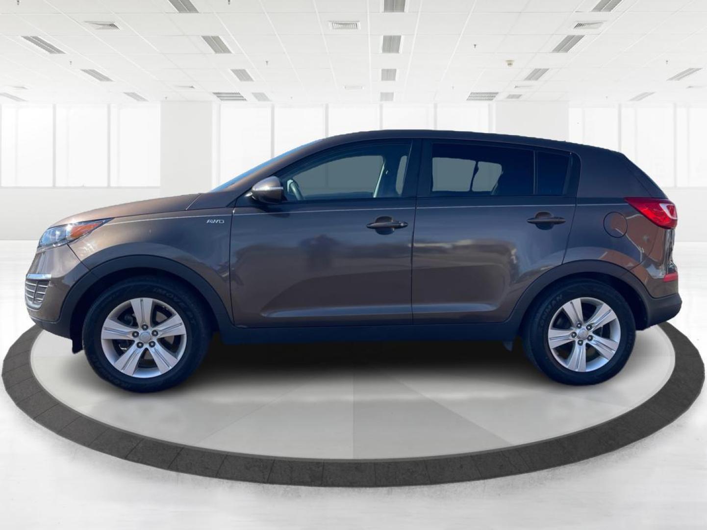 2012 Kia Sportage LX (KNDPBCA20C7) with an 2.4L I-4 DOHC engine, located at 401 Woodman Dr, Riverside, OH, 45431, (937) 908-9800, 39.760899, -84.123421 - Photo#5