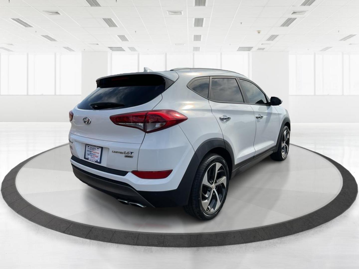 2016 Hyundai Tucson Limited (KM8J3CA20GU) with an 1.6L I-4 gasoline direct injection engine, located at 1099 N County Rd 25A, Troy, OH, 45373, (937) 908-9800, 40.057079, -84.212883 - Photo#2