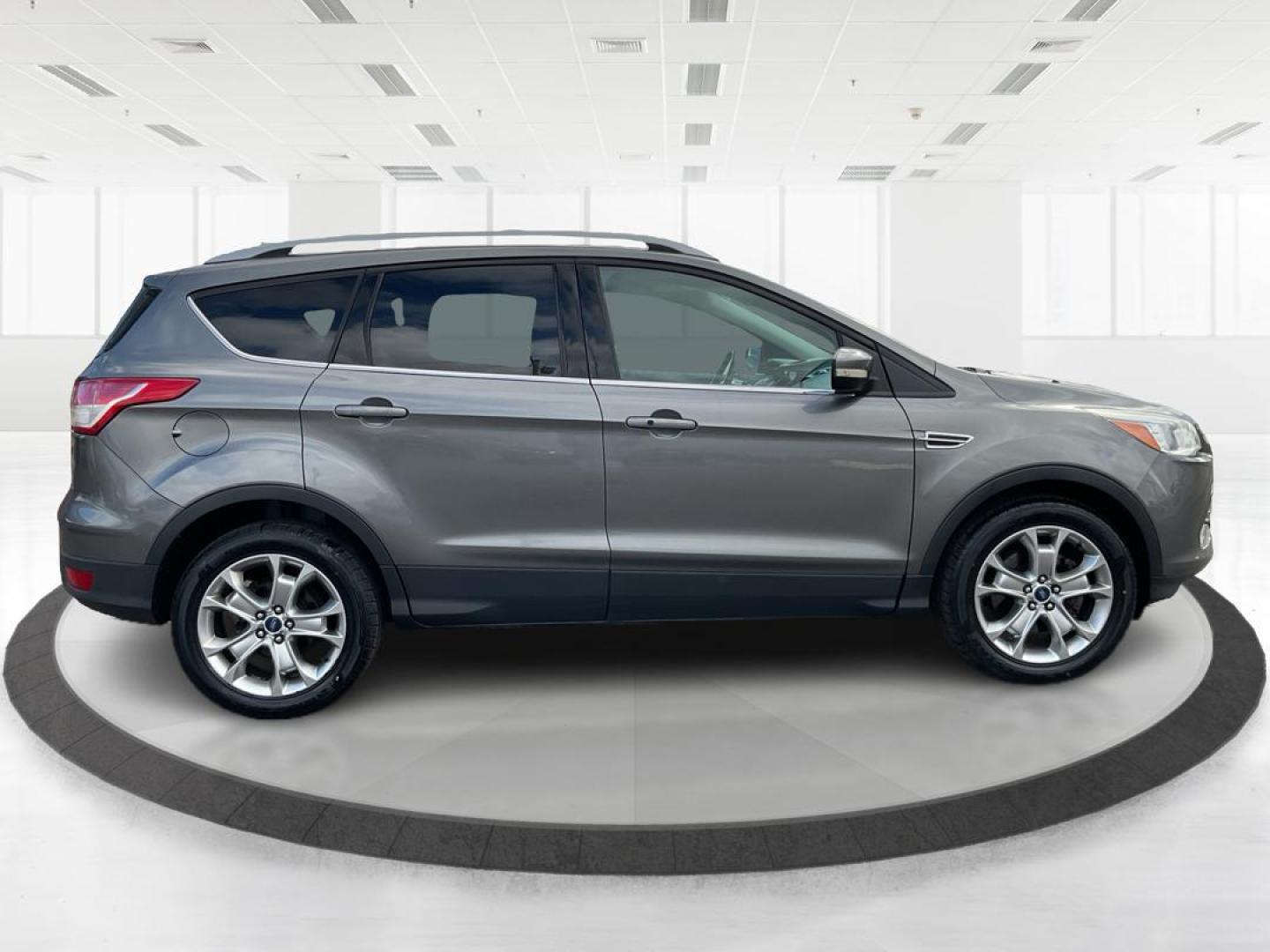 2014 Ford Escape Titanium (1FMCU9J95EU) with an EcoBoost 1.6L I-4 gasoline direct injection engine, located at 8750 N County Rd 25A, Piqua, OH, 45356, (937) 908-9800, 40.164391, -84.232513 - Photo#1