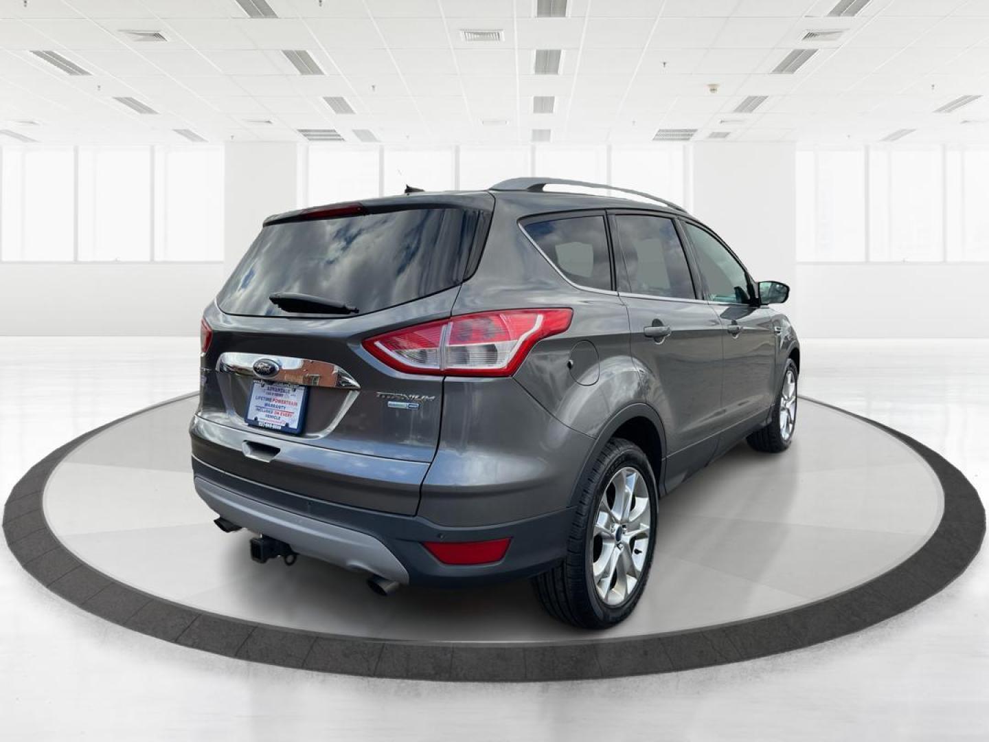 2014 Ford Escape Titanium (1FMCU9J95EU) with an EcoBoost 1.6L I-4 gasoline direct injection engine, located at 8750 N County Rd 25A, Piqua, OH, 45356, (937) 908-9800, 40.164391, -84.232513 - Photo#2