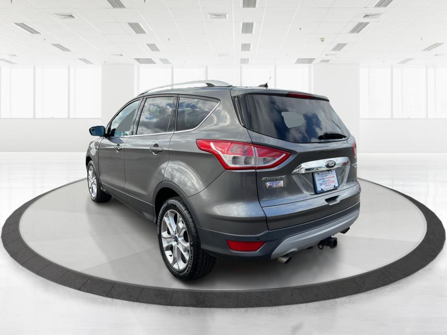 2014 Ford Escape Titanium (1FMCU9J95EU) with an EcoBoost 1.6L I-4 gasoline direct injection engine, located at 8750 N County Rd 25A, Piqua, OH, 45356, (937) 908-9800, 40.164391, -84.232513 - Photo#4