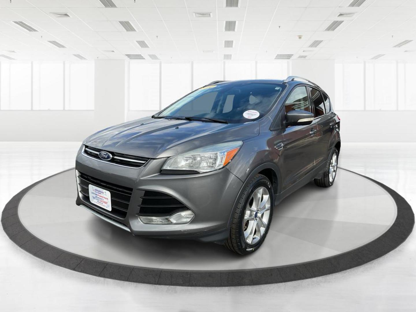 2014 Ford Escape Titanium (1FMCU9J95EU) with an EcoBoost 1.6L I-4 gasoline direct injection engine, located at 8750 N County Rd 25A, Piqua, OH, 45356, (937) 908-9800, 40.164391, -84.232513 - Photo#7