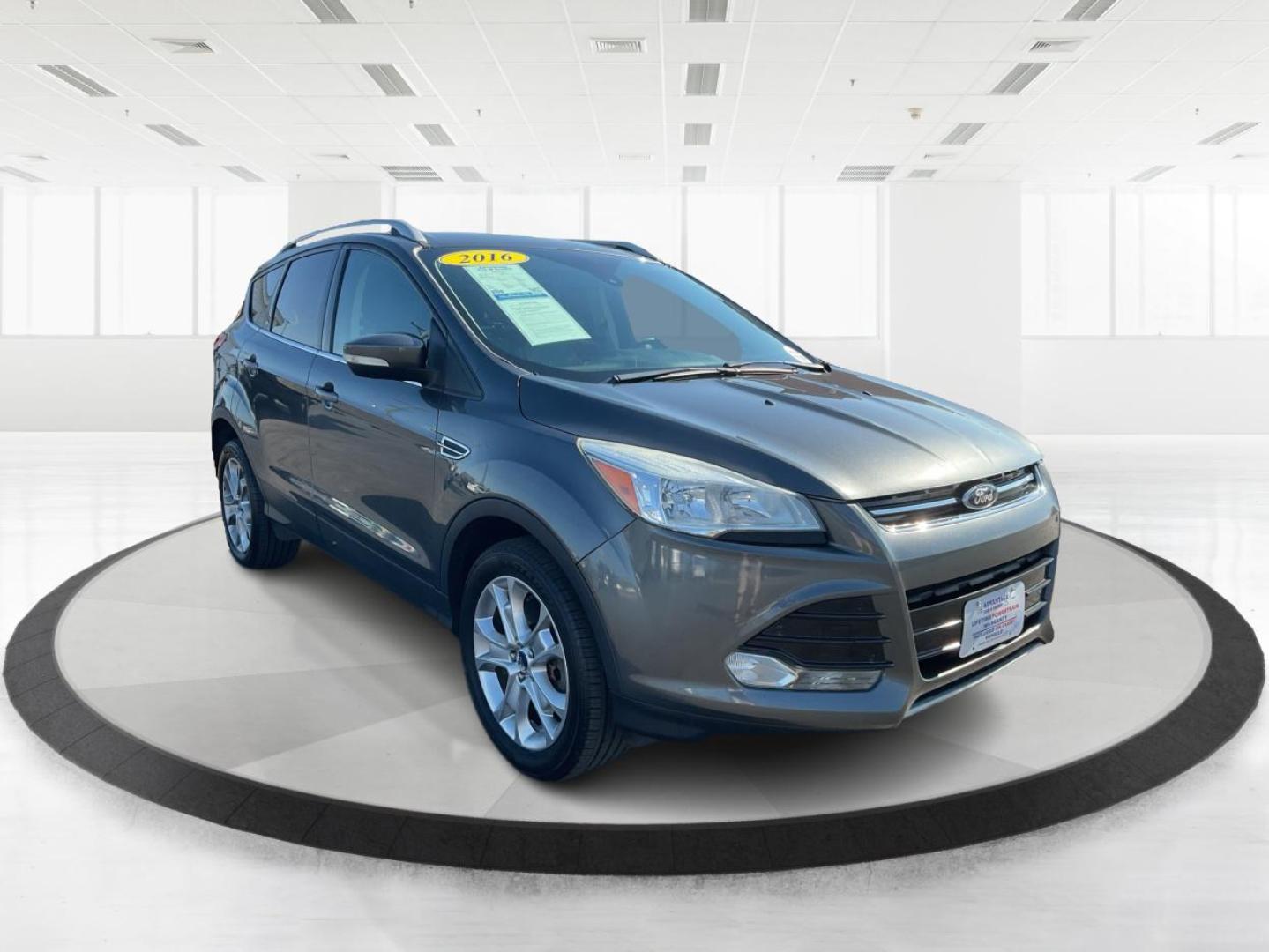 2016 Ford Escape Titanium (1FMCU9J92GU) with an EcoBoost 1.6L I-4 gasoline direct injection engine, located at 1184 Kauffman Ave, Fairborn, OH, 45324, (937) 908-9800, 39.807072, -84.030914 - Photo#0