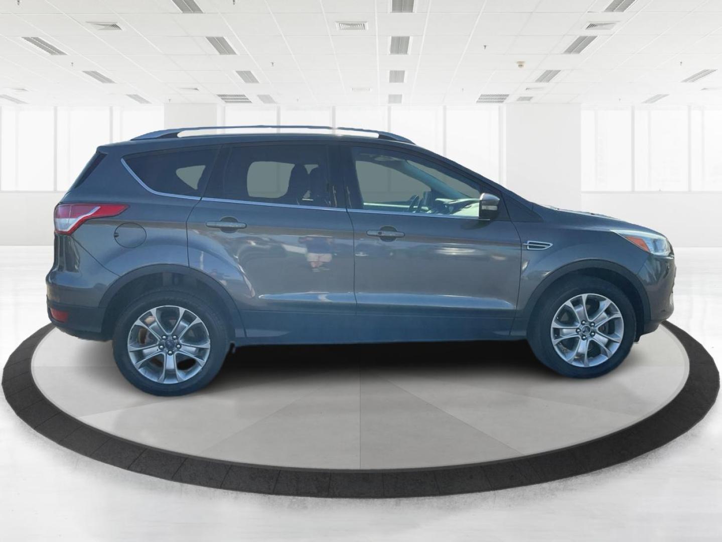 2016 Ford Escape Titanium (1FMCU9J92GU) with an EcoBoost 1.6L I-4 gasoline direct injection engine, located at 1184 Kauffman Ave, Fairborn, OH, 45324, (937) 908-9800, 39.807072, -84.030914 - Photo#1