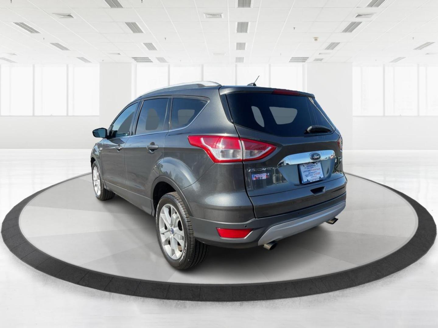 2016 Ford Escape Titanium (1FMCU9J92GU) with an EcoBoost 1.6L I-4 gasoline direct injection engine, located at 1184 Kauffman Ave, Fairborn, OH, 45324, (937) 908-9800, 39.807072, -84.030914 - Photo#4