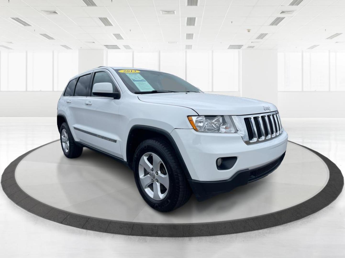 2013 Jeep Grand Cherokee Laredo (1C4RJFAG8DC) with an 3.6L V-6 DOHC engine, located at 880 E. National Road, Vandalia, OH, 45377, (937) 908-9800, 39.891918, -84.183594 - Photo#0