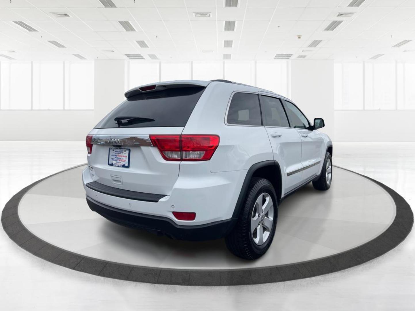 2013 Jeep Grand Cherokee Laredo (1C4RJFAG8DC) with an 3.6L V-6 DOHC engine, located at 880 E. National Road, Vandalia, OH, 45377, (937) 908-9800, 39.891918, -84.183594 - Photo#2
