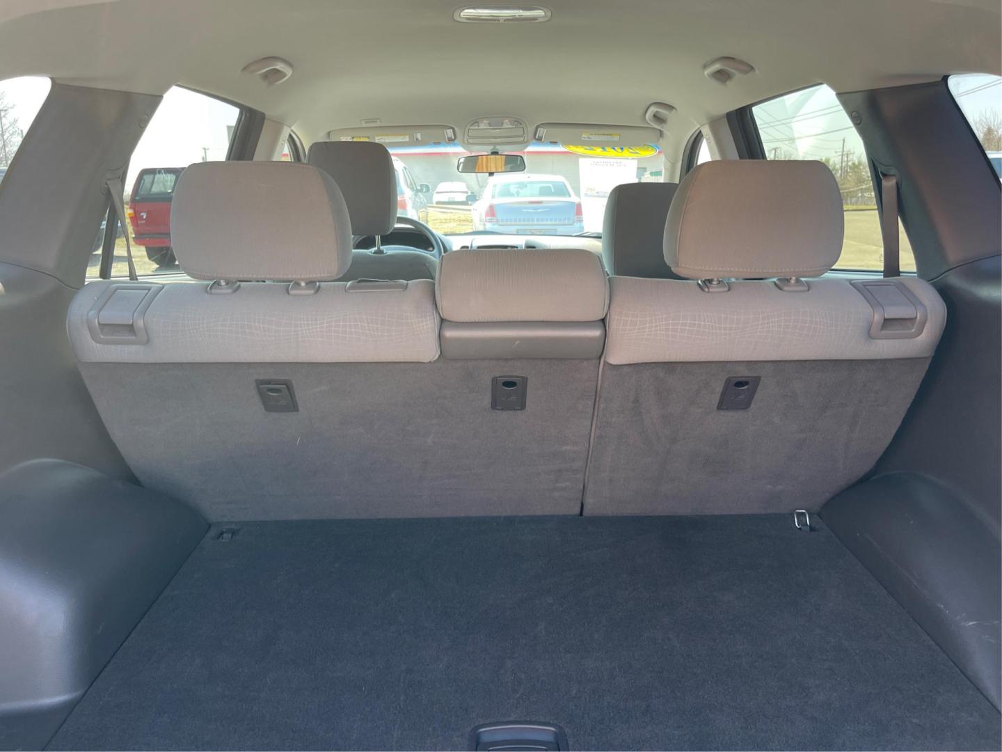 2012 Hyundai Santa Fe GLS (5XYZG3ABXCG) with an 2.4L I-4 DOHC engine, located at 401 Woodman Dr, Riverside, OH, 45431, (937) 908-9800, 39.760899, -84.123421 - 2012 Hyundai Santa Fe GLS - Photo#11