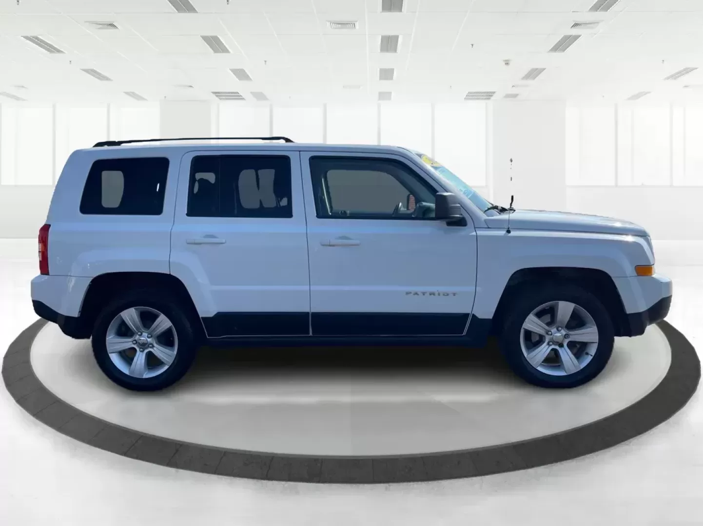 2014 Jeep Patriot Latitude (1C4NJPFB0ED) with an 2.4L I-4 DOHC engine, located at 1099 N County Rd 25A, Troy, OH, 45373, (937) 908-9800, 40.057079, -84.212883 - Photo#1