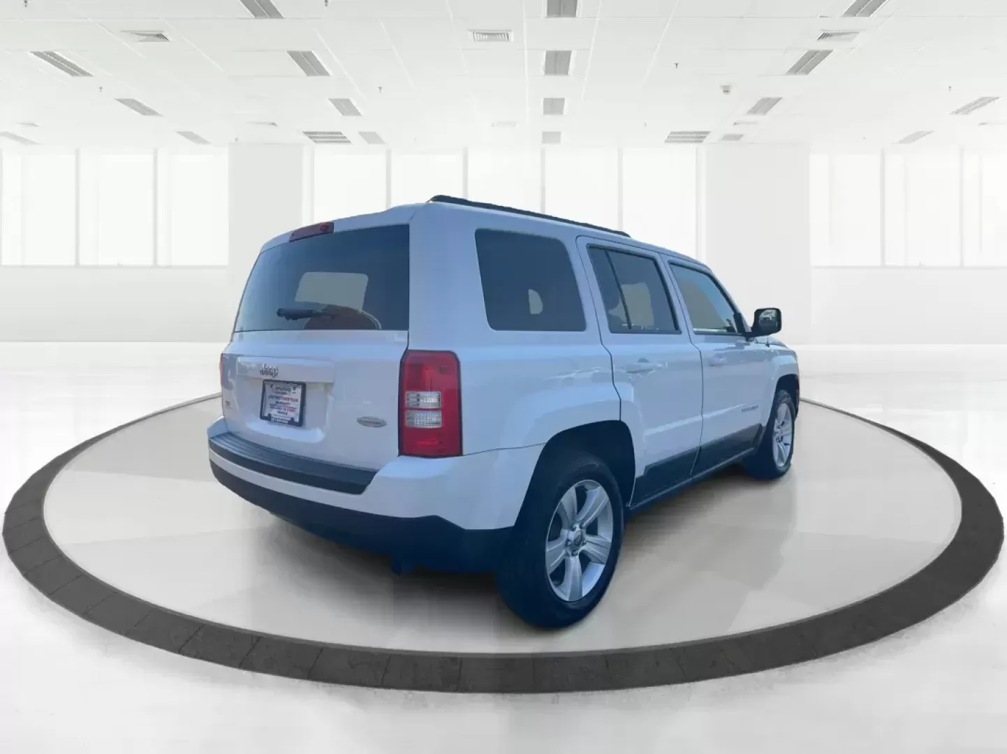 2014 Jeep Patriot Latitude (1C4NJPFB0ED) with an 2.4L I-4 DOHC engine, located at 1099 N County Rd 25A, Troy, OH, 45373, (937) 908-9800, 40.057079, -84.212883 - Photo#2