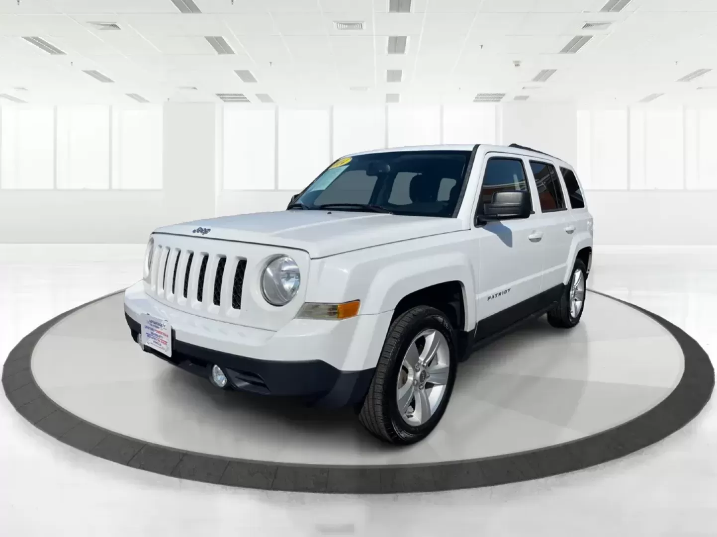 2014 Jeep Patriot Latitude (1C4NJPFB0ED) with an 2.4L I-4 DOHC engine, located at 1099 N County Rd 25A, Troy, OH, 45373, (937) 908-9800, 40.057079, -84.212883 - Photo#8