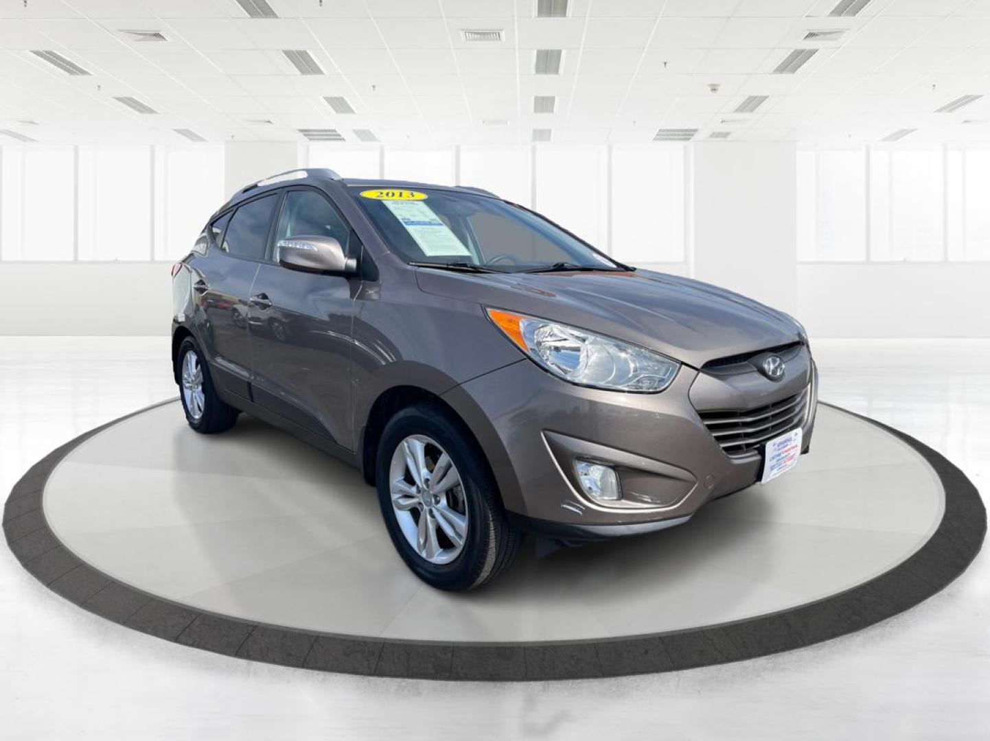 2013 Hyundai Tucson GLS (KM8JU3AC1DU) with an Theta II 2.4L I-4 DOHC engine, located at 1099 N County Rd 25A, Troy, OH, 45373, (937) 908-9800, 40.057079, -84.212883 - Photo#0