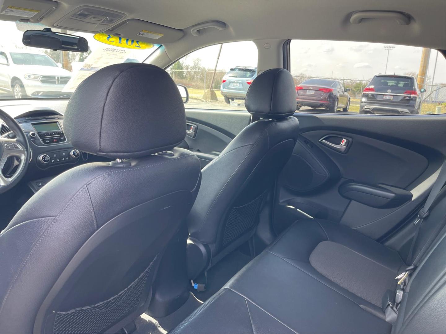 2013 Hyundai Tucson GLS (KM8JU3AC1DU) with an Theta II 2.4L I-4 DOHC engine, located at 1099 N County Rd 25A, Troy, OH, 45373, (937) 908-9800, 40.057079, -84.212883 - Photo#9