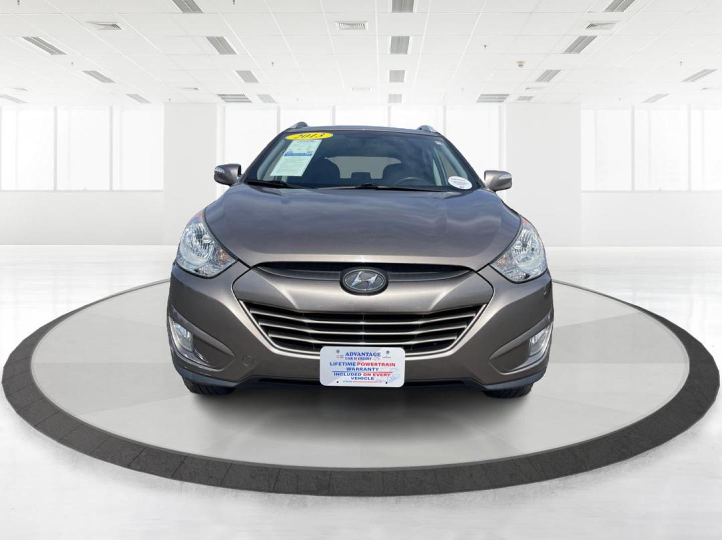 2013 Hyundai Tucson GLS (KM8JU3AC1DU) with an Theta II 2.4L I-4 DOHC engine, located at 1099 N County Rd 25A, Troy, OH, 45373, (937) 908-9800, 40.057079, -84.212883 - Photo#6