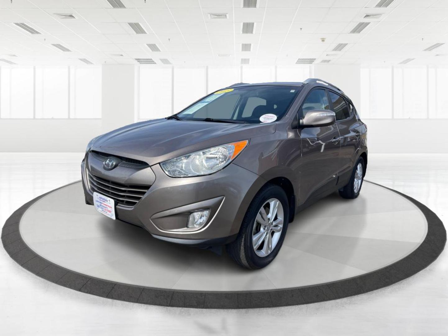 2013 Hyundai Tucson GLS (KM8JU3AC1DU) with an Theta II 2.4L I-4 DOHC engine, located at 1099 N County Rd 25A, Troy, OH, 45373, (937) 908-9800, 40.057079, -84.212883 - Photo#7