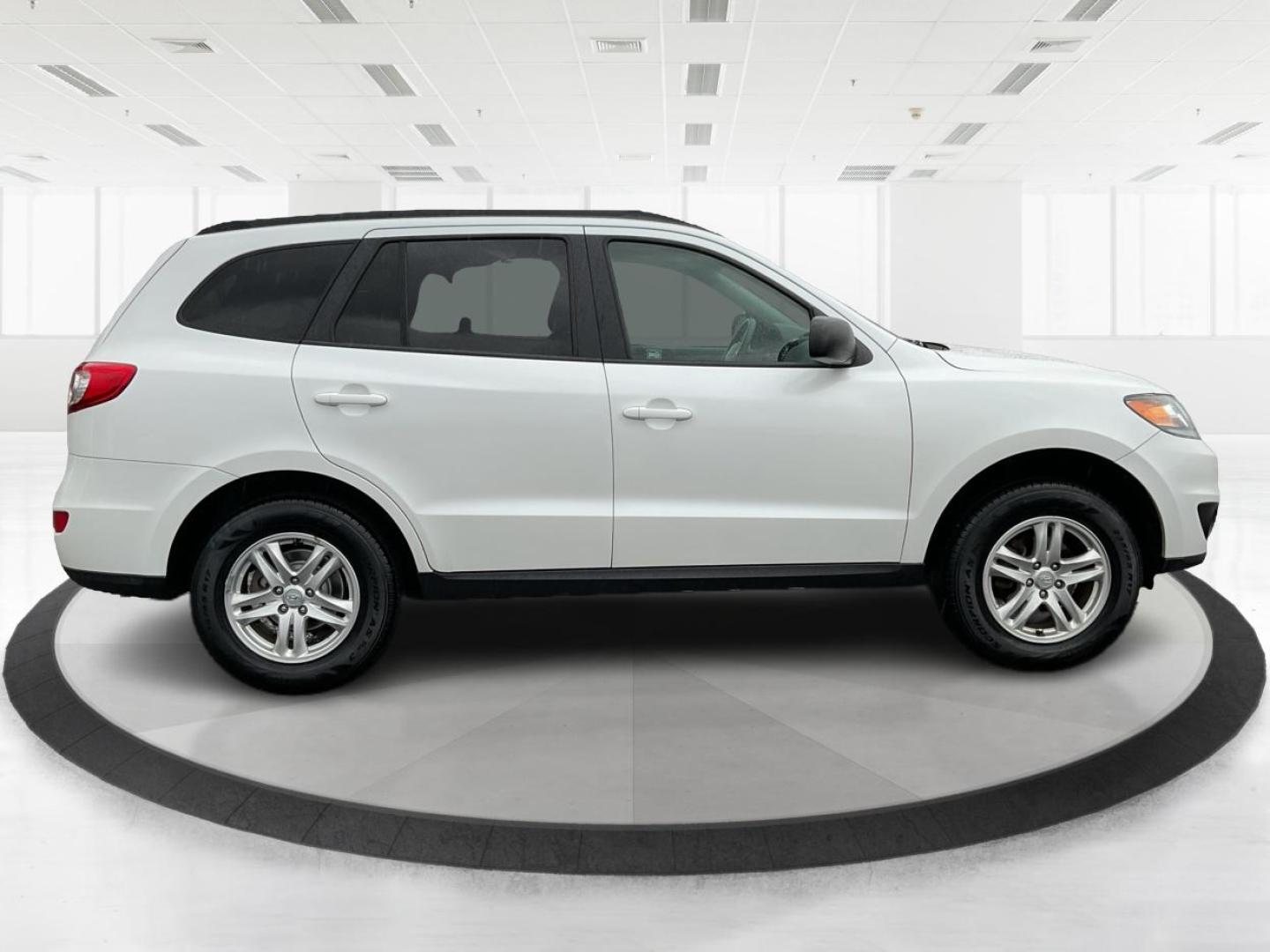 2012 Hyundai Santa Fe GLS (5XYZGDAB5CG) with an 2.4L I-4 DOHC engine, located at 1099 N County Rd 25A, Troy, OH, 45373, (937) 908-9800, 40.057079, -84.212883 - Photo#1