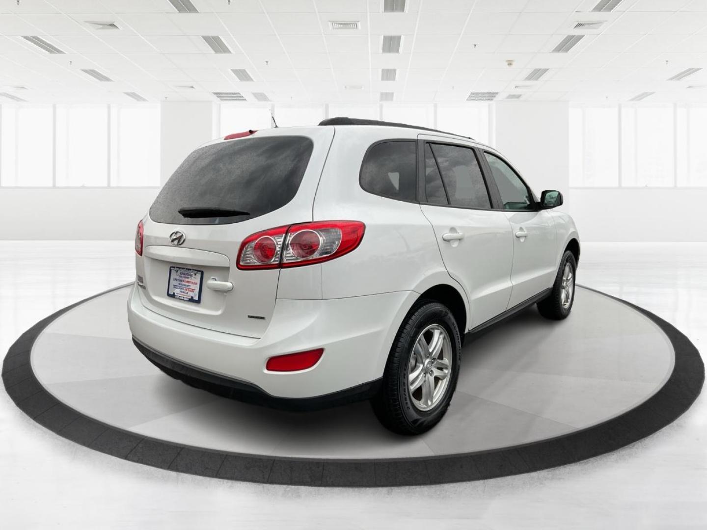 2012 Hyundai Santa Fe GLS (5XYZGDAB5CG) with an 2.4L I-4 DOHC engine, located at 1099 N County Rd 25A, Troy, OH, 45373, (937) 908-9800, 40.057079, -84.212883 - Photo#2