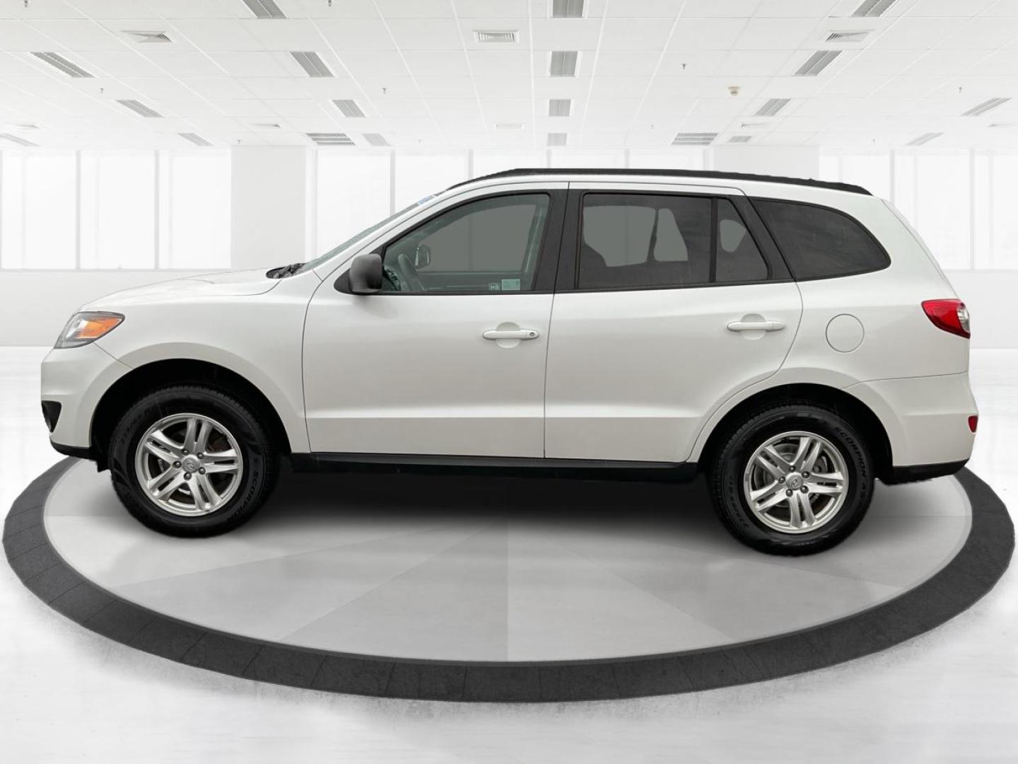 2012 Hyundai Santa Fe GLS (5XYZGDAB5CG) with an 2.4L I-4 DOHC engine, located at 1099 N County Rd 25A, Troy, OH, 45373, (937) 908-9800, 40.057079, -84.212883 - Photo#5