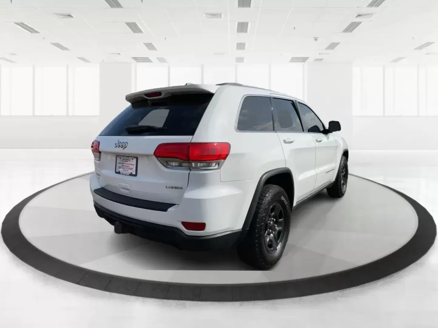 2014 Jeep Grand Cherokee Laredo (1C4RJFAGXEC) with an 3.6L V-6 DOHC engine, located at 1951 S Dayton Lakeview Rd., New Carlisle, OH, 45344, (937) 908-9800, 39.890999, -84.050255 - Photo#2