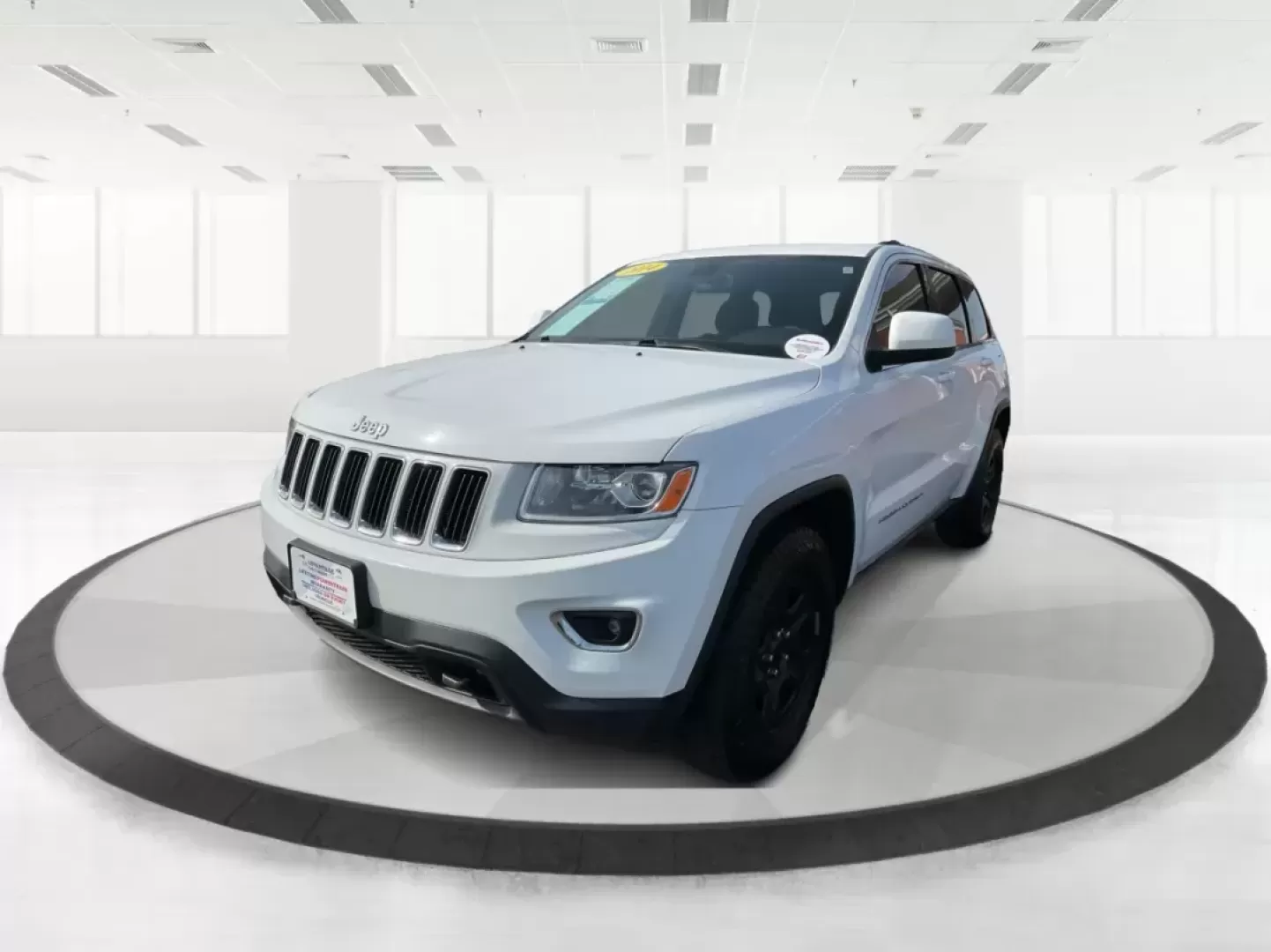 2014 Jeep Grand Cherokee Laredo (1C4RJFAGXEC) with an 3.6L V-6 DOHC engine, located at 1951 S Dayton Lakeview Rd., New Carlisle, OH, 45344, (937) 908-9800, 39.890999, -84.050255 - Photo#7