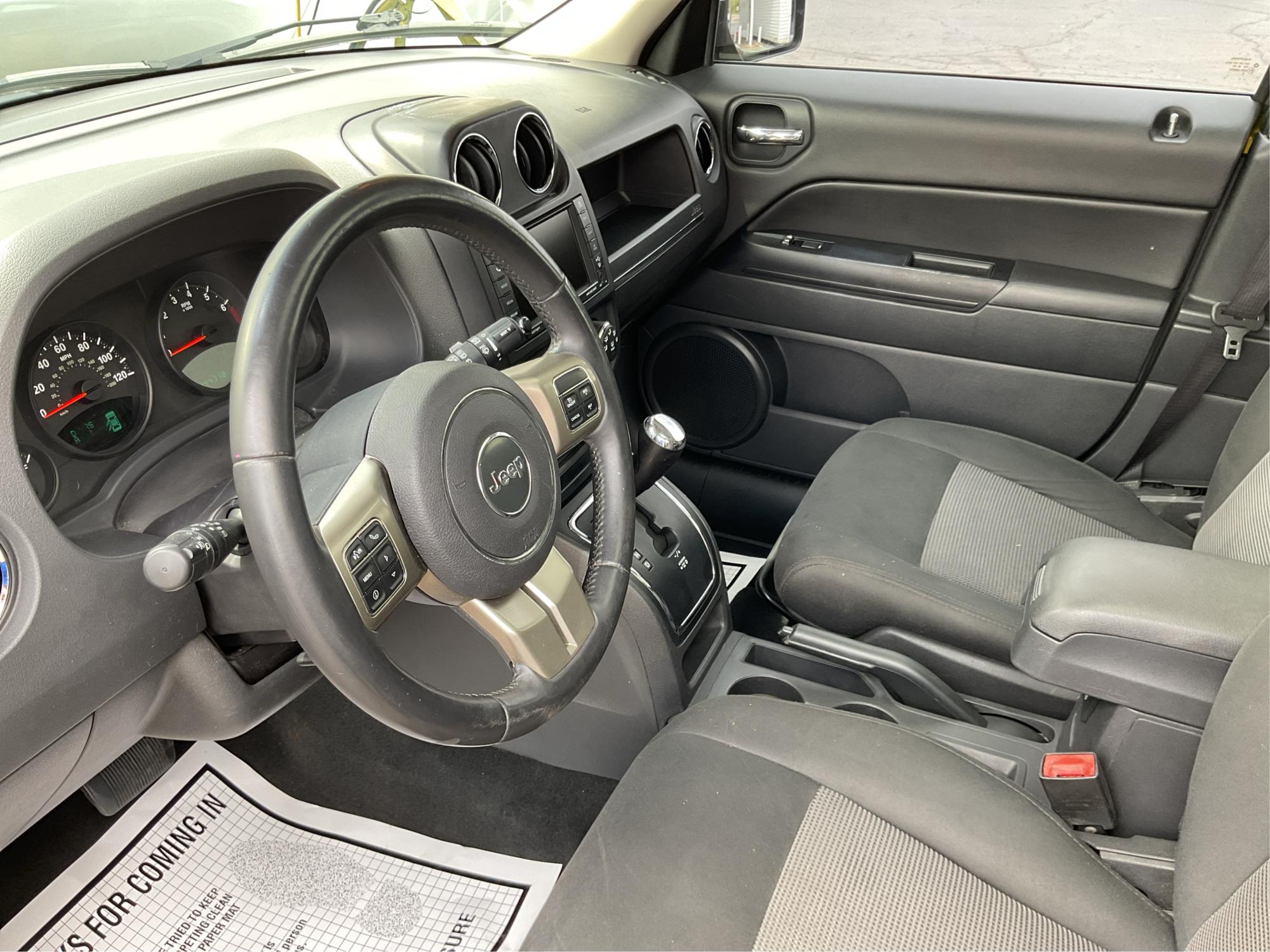 2012 Jeep Patriot Latitude 2WD (1C4NJPFA7CD) with an 2.0L L4 DOHC 16V engine, located at 401 Woodman Dr, Riverside, OH, 45431, (937) 908-9800, 39.760899, -84.123421 - Photo#9