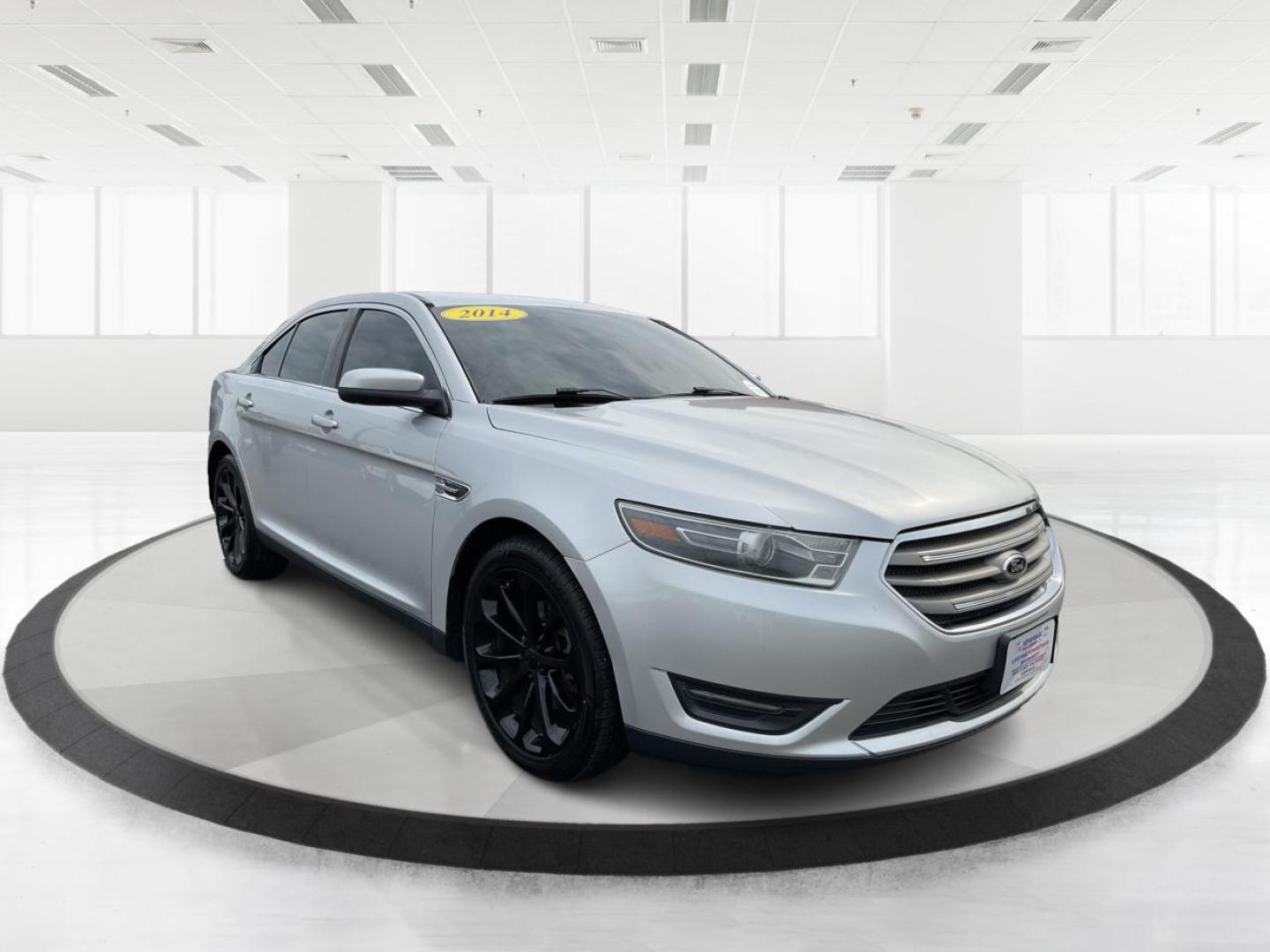 2014 Ford Taurus SEL (1FAHP2E86EG) with an EcoBoost 2L I-4 gasoline direct injection engine, located at 1099 N County Rd 25A, Troy, OH, 45373, (937) 908-9800, 40.057079, -84.212883 - Photo#0