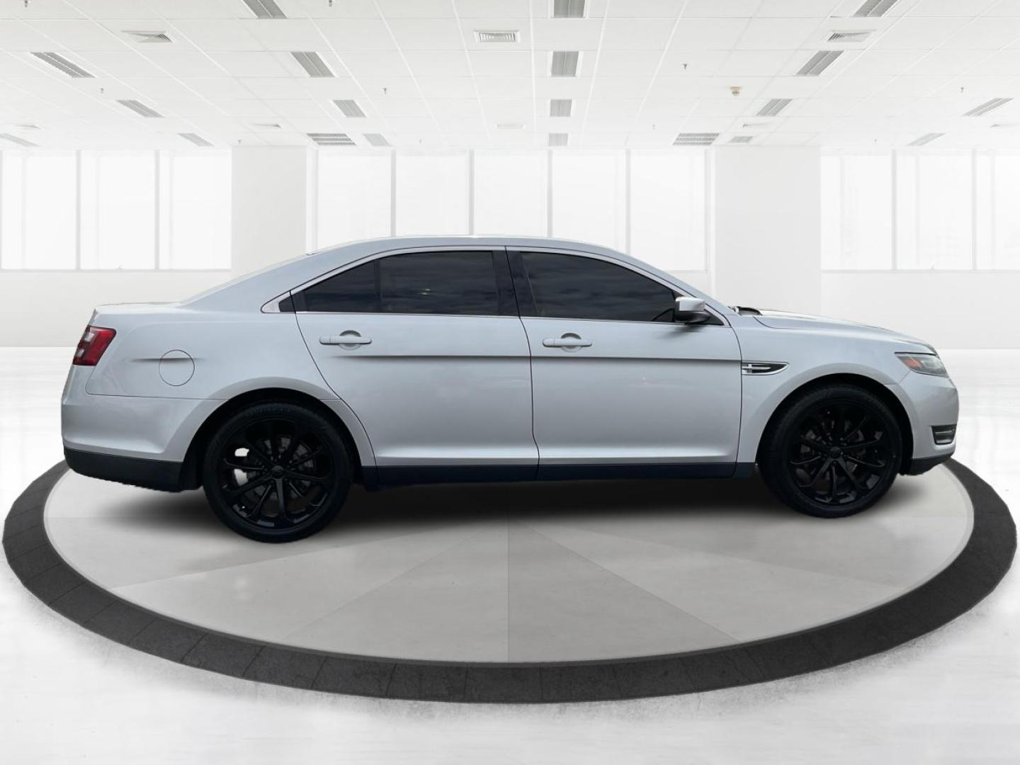 2014 Ford Taurus SEL (1FAHP2E86EG) with an EcoBoost 2L I-4 gasoline direct injection engine, located at 1099 N County Rd 25A, Troy, OH, 45373, (937) 908-9800, 40.057079, -84.212883 - Photo#1