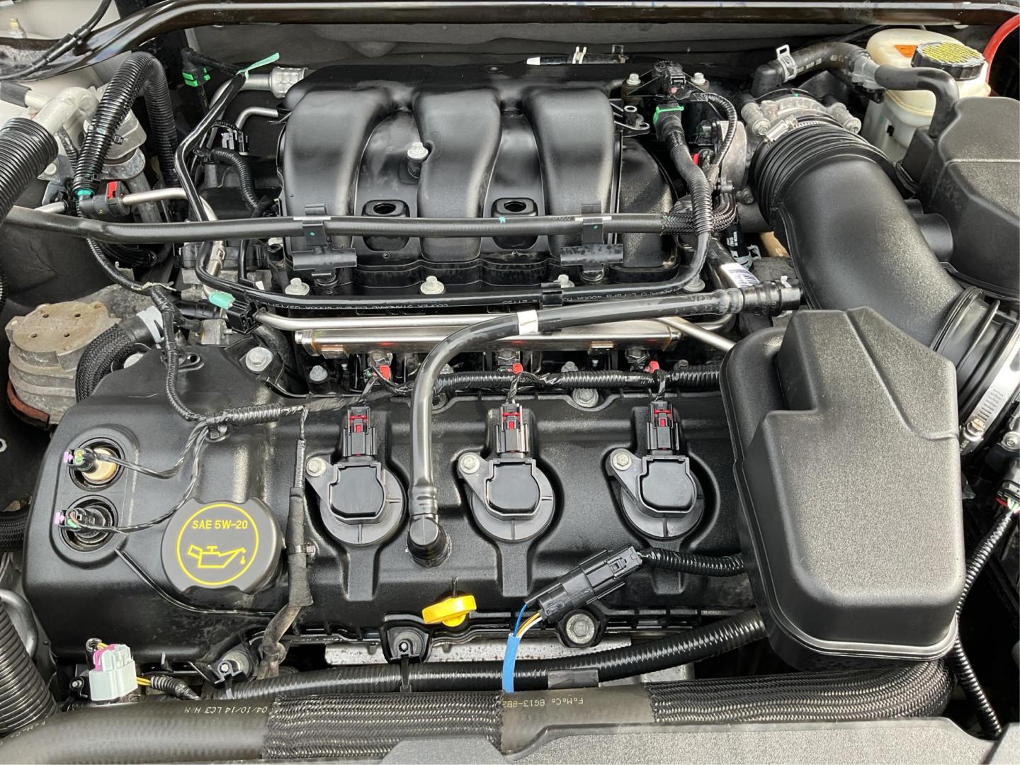 2014 Ford Taurus SEL (1FAHP2E86EG) with an EcoBoost 2L I-4 gasoline direct injection engine, located at 1099 N County Rd 25A, Troy, OH, 45373, (937) 908-9800, 40.057079, -84.212883 - Photo#11