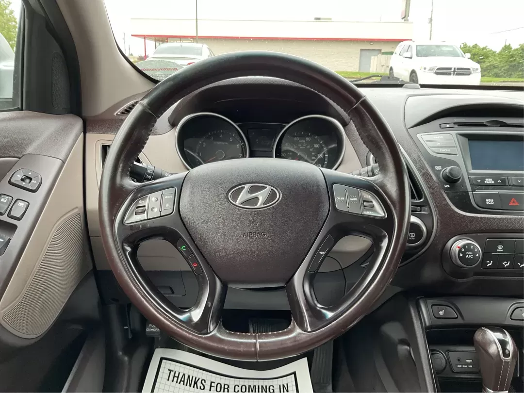 2015 Hyundai Tucson SE (KM8JUCAG2FU) with an Theta II 2.4L I-4 gasoline direct injection engine, located at 880 E. National Road, Vandalia, OH, 45377, (937) 908-9800, 39.891918, -84.183594 - 2015 Hyundai Tucson SE - Photo#15