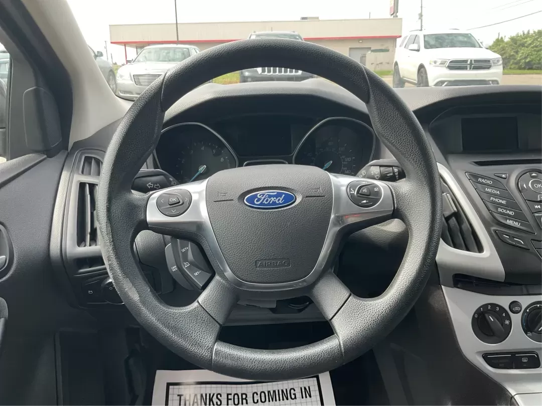 2014 Ford Focus SE (1FADP3F21EL) with an 2L I-4 gasoline direct injection engine, located at 1099 N County Rd 25A , Troy, OH, 45373, (937) 908-9800, 40.057079, -84.212883 - 2014 Ford Focus SE - Photo#15