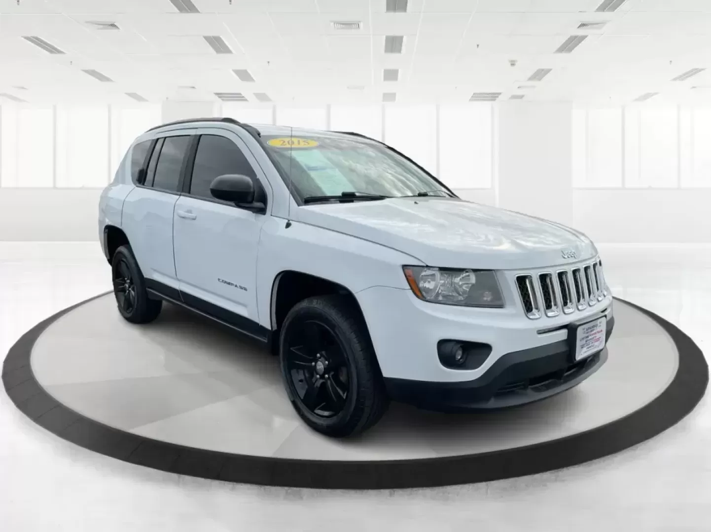 2015 Jeep Compass Sport (1C4NJDBB6FD) with an 2.4L I-4 DOHC engine, located at 1099 N County Rd 25A, Troy, OH, 45373, (937) 908-9800, 40.057079, -84.212883 - 2015 Jeep Compass Sport - Photo#0