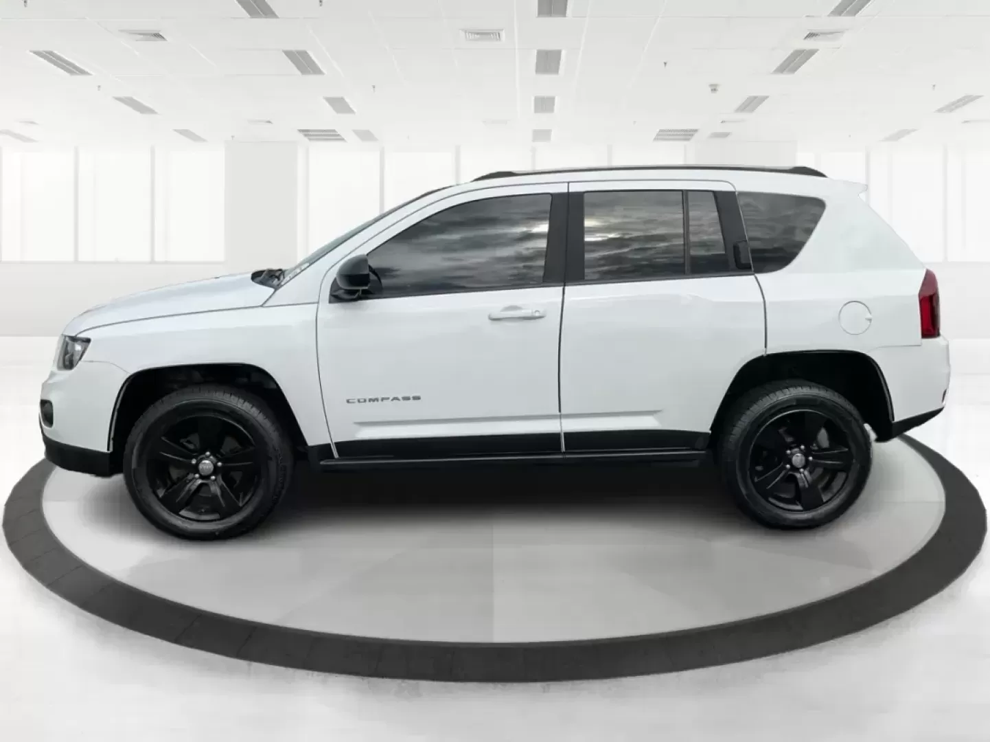 2015 Jeep Compass Sport (1C4NJDBB6FD) with an 2.4L I-4 DOHC engine, located at 1099 N County Rd 25A, Troy, OH, 45373, (937) 908-9800, 40.057079, -84.212883 - 2015 Jeep Compass Sport - Photo#5