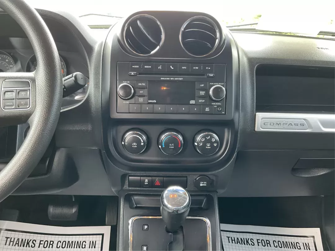 2015 Jeep Compass Sport (1C4NJDBB6FD) with an 2.4L I-4 DOHC engine, located at 1099 N County Rd 25A , Troy, OH, 45373, (937) 908-9800, 40.057079, -84.212883 - 2015 Jeep Compass Sport - Photo#12