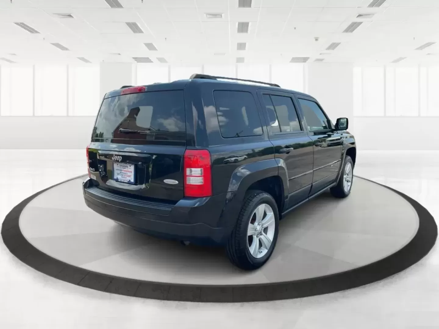2012 Jeep Patriot Latitude (1C4NJRFB1CD) with an 2.4L I-4 DOHC engine, located at 1951 S Dayton Lakeview Rd., New Carlisle, OH, 45344, (937) 908-9800, 39.890999, -84.050255 - Photo#2