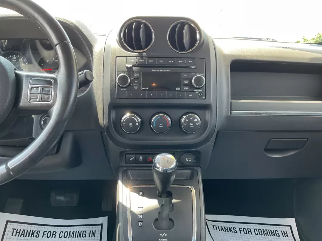 2012 Jeep Patriot Latitude (1C4NJRFB1CD) with an 2.4L I-4 DOHC engine, located at 1951 S Dayton Lakeview Rd., New Carlisle, OH, 45344, (937) 908-9800, 39.890999, -84.050255 - 2012 Jeep Patriot Latitude - Photo#12
