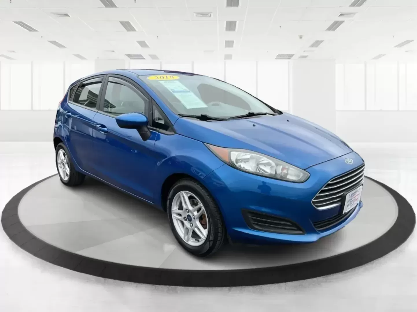 2018 Ford Fiesta SE (3FADP4EJ2JM) with an 1.6L I-4 DOHC engine, located at 8750 N County Rd 25A, Piqua, OH, 45356, (937) 908-9800, 40.164391, -84.232513 - Photo#0