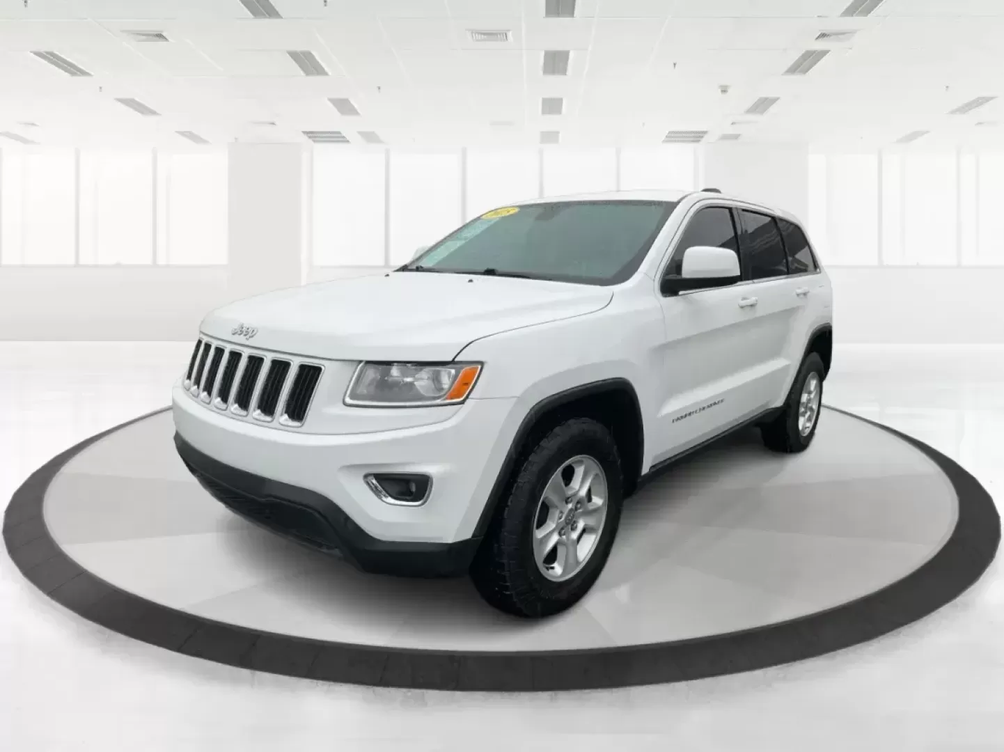 2015 Jeep Grand Cherokee Laredo (1C4RJFAG7FC) with an 3.6L V-6 DOHC engine, located at 8750 N County Rd 25A, Piqua, OH, 45356, (937) 908-9800, 40.164391, -84.232513 - Photo#7