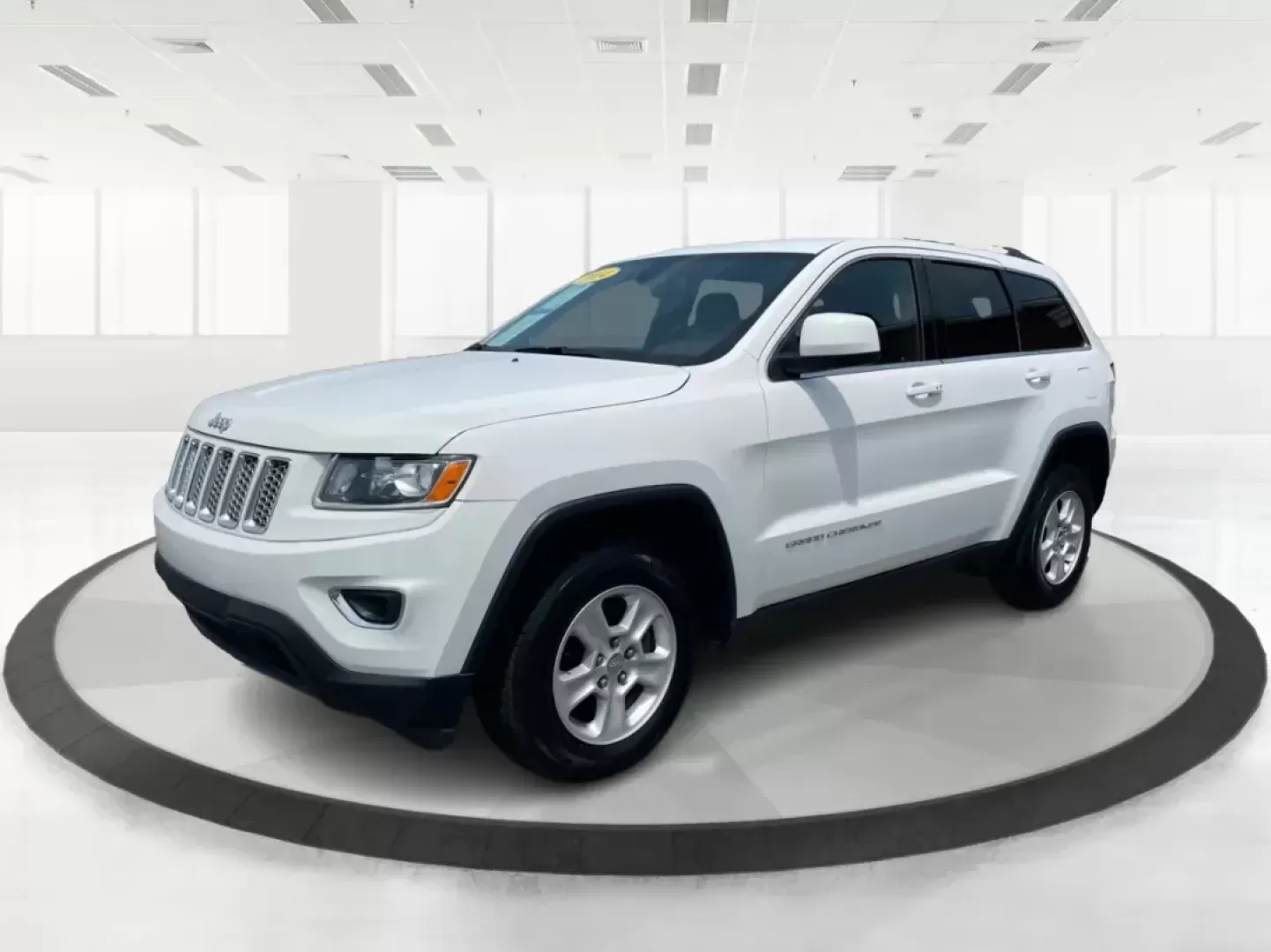 2014 Jeep Grand Cherokee Laredo (1C4RJFAGXEC) with an 3.6L V-6 DOHC engine, located at 880 E. National Road, Vandalia, OH, 45377, (937) 908-9800, 39.891918, -84.183594 - 2014 Jeep Grand Cherokee Laredo - Photo#7