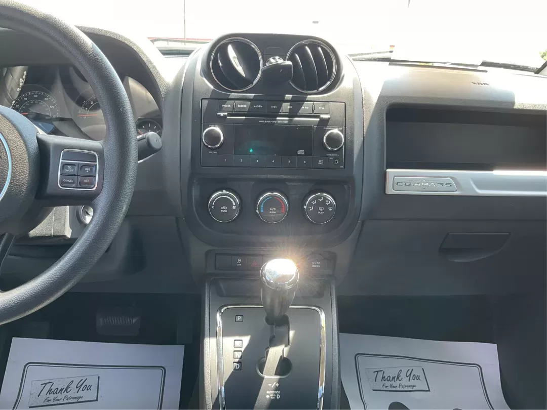 2014 Jeep Compass Sport (1C4NJDBB6ED) with an 2.4L I-4 DOHC engine, located at 401 Woodman Dr, Riverside, OH, 45431, (937) 908-9800, 39.760899, -84.123421 - Photo#12