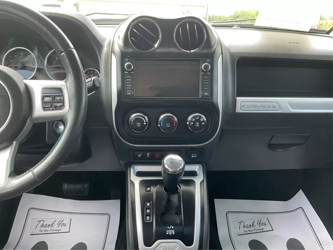 2016 Jeep Compass High Altitude Edition (1C4NJDEB6GD) with an 2.4L I-4 DOHC engine, located at 8750 N County Rd 25A, Piqua, OH, 45356, (937) 908-9800, 40.164391, -84.232513 - Photo#12