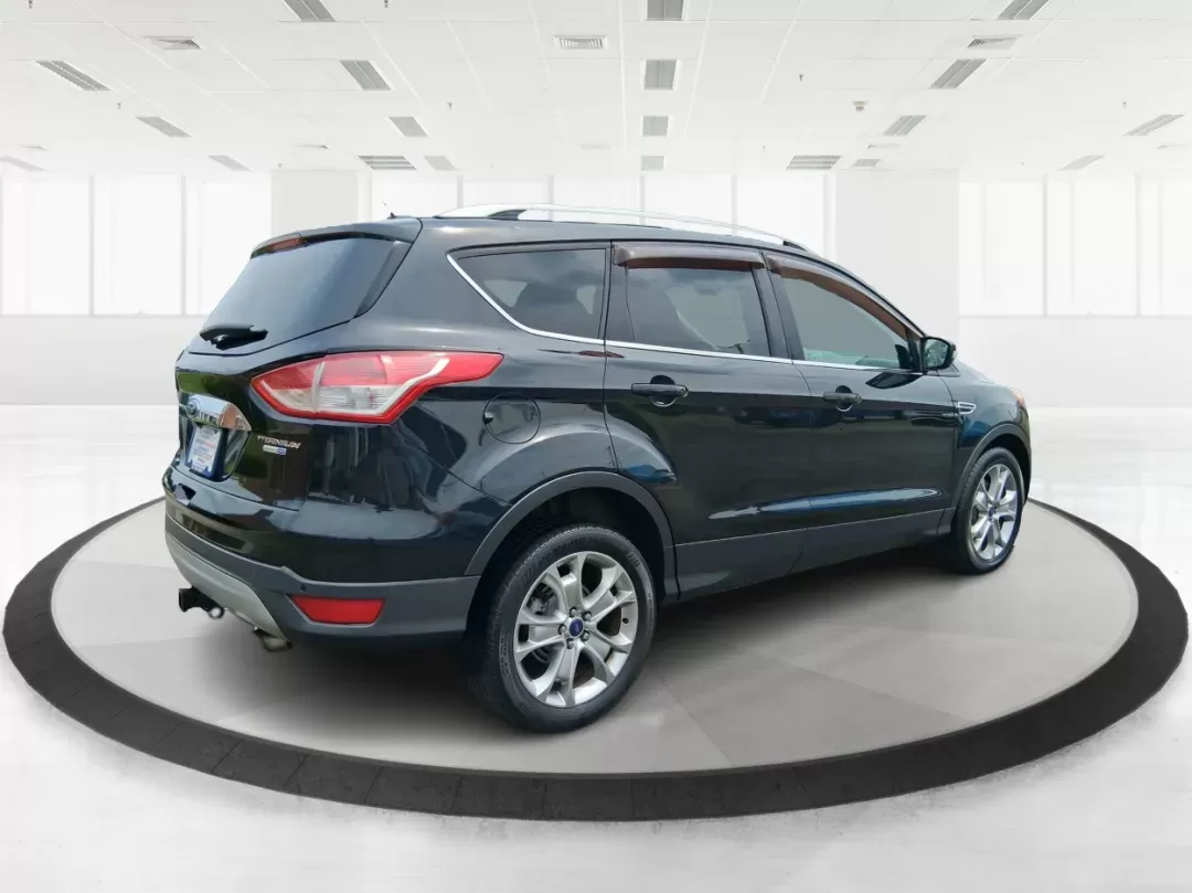 2014 Ford Escape Titanium (1FMCU9J96EU) with an EcoBoost 1.6L I-4 gasoline direct injection engine, located at 4508 South Dixie Dr, Moraine, OH, 45439, (937) 908-9800, 39.689976, -84.218452 - Photo#2