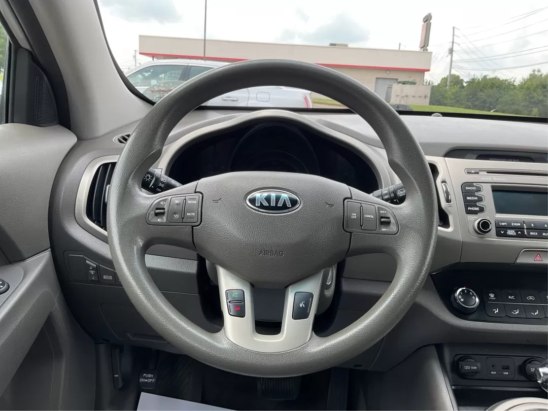 2014 Kia Sportage LX (KNDPBCAC6E7) with an Other engine, located at 8750 N County Rd 25A, Piqua, OH, 45356, (937) 908-9800, 40.164391, -84.232513 - **Adventure Awaits: 2014 Kia Sportage LX Ready for Your Next Journey!**<br /> <br /> Are you in search of a reliable vehicle that combines style, comfort, and versatility? Look no further than this 2014 Kia Sportage LX, perfect for weekend getaways, family road trips, or daily commutes. This crossov - Photo#14