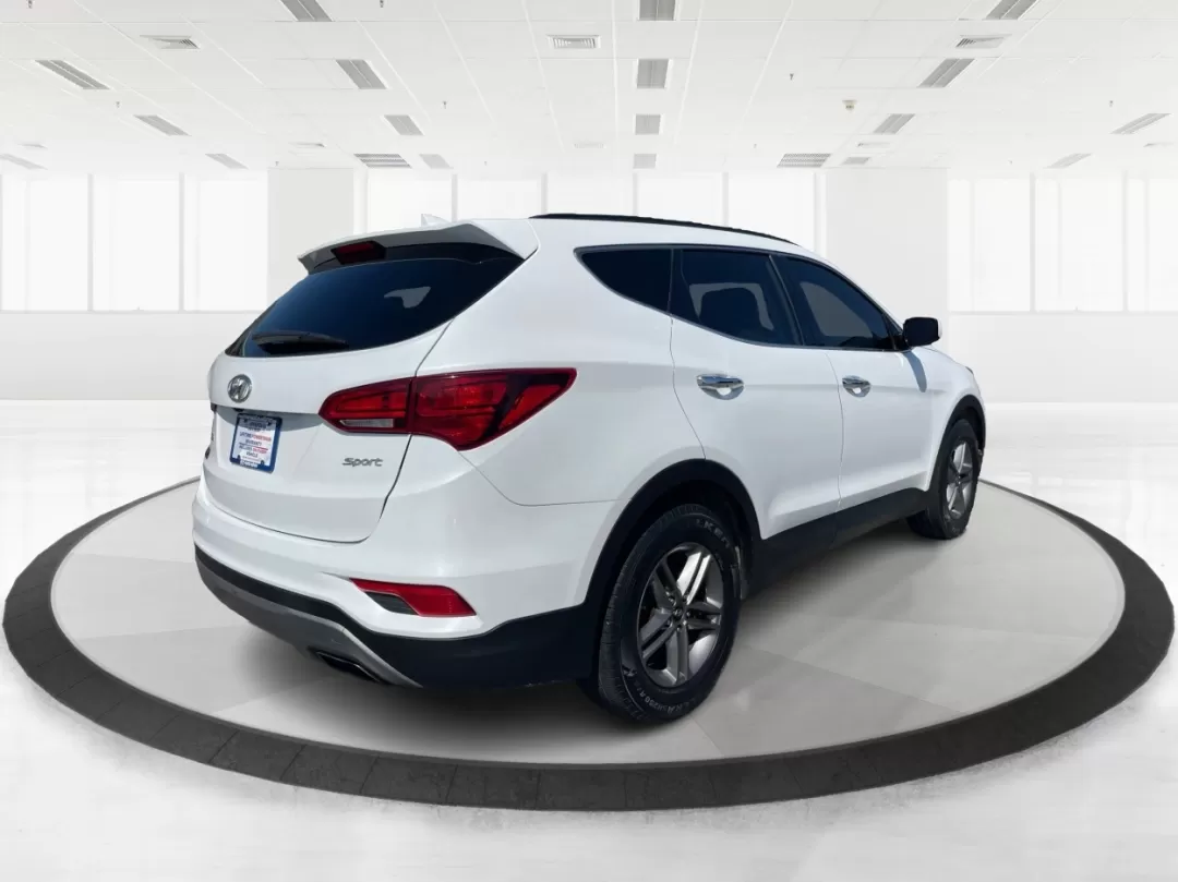 2017 Hyundai Santa Fe 2.4L (5XYZU3LB3HG) with an Theta II 2.4L I-4 gasoline direct injection engine, located at 1230 East Main St, Xenia, OH, 45385, (937) 908-9800, 39.688026, -83.910172 - Photo#2