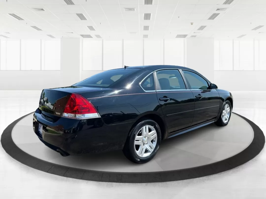 2014 Chevrolet Impala Limited LT (2G1WB5E3XE1) with an 3.6L V-6 gasoline direct injection engine, located at 1951 S Dayton Lakeview Rd., New Carlisle, OH, 45344, (937) 908-9800, 39.890999, -84.050255 - Are you ready for your next adventure, whether it's a family road trip, a daily commute, or simply running errands around Fairborn? The 2014 Chevrolet Impala Limited LT is the perfect sedan to elevate your driving experience. With its stylish black exterior and reliable performance, this vehicle is - Photo#2