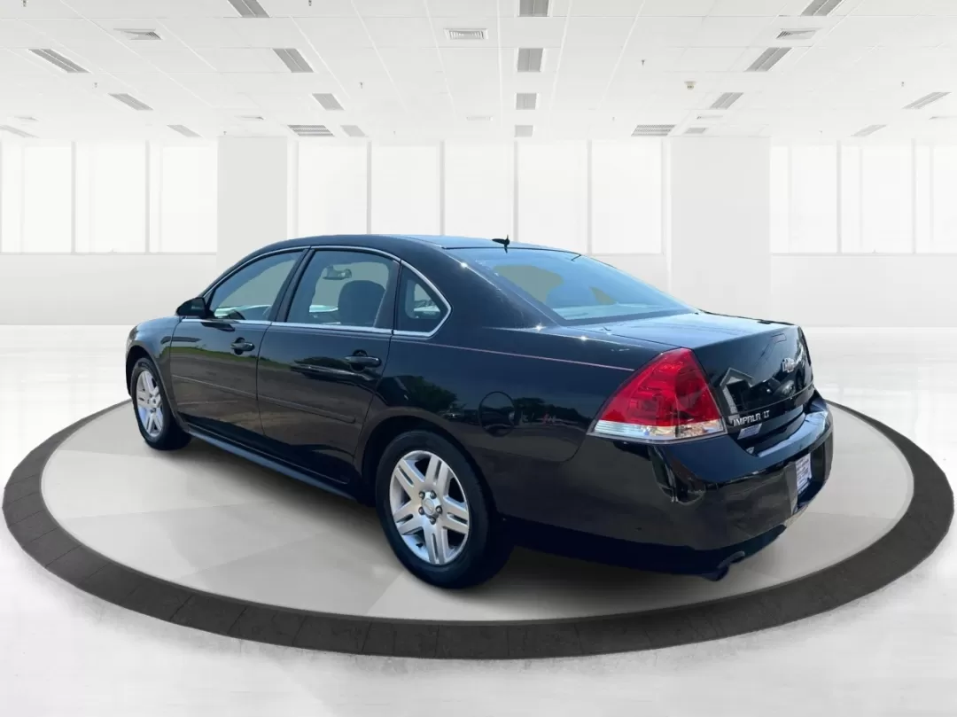 2014 Chevrolet Impala Limited LT (2G1WB5E3XE1) with an 3.6L V-6 gasoline direct injection engine, located at 1951 S Dayton Lakeview Rd., New Carlisle, OH, 45344, (937) 908-9800, 39.890999, -84.050255 - Are you ready for your next adventure, whether it's a family road trip, a daily commute, or simply running errands around Fairborn? The 2014 Chevrolet Impala Limited LT is the perfect sedan to elevate your driving experience. With its stylish black exterior and reliable performance, this vehicle is - Photo#4