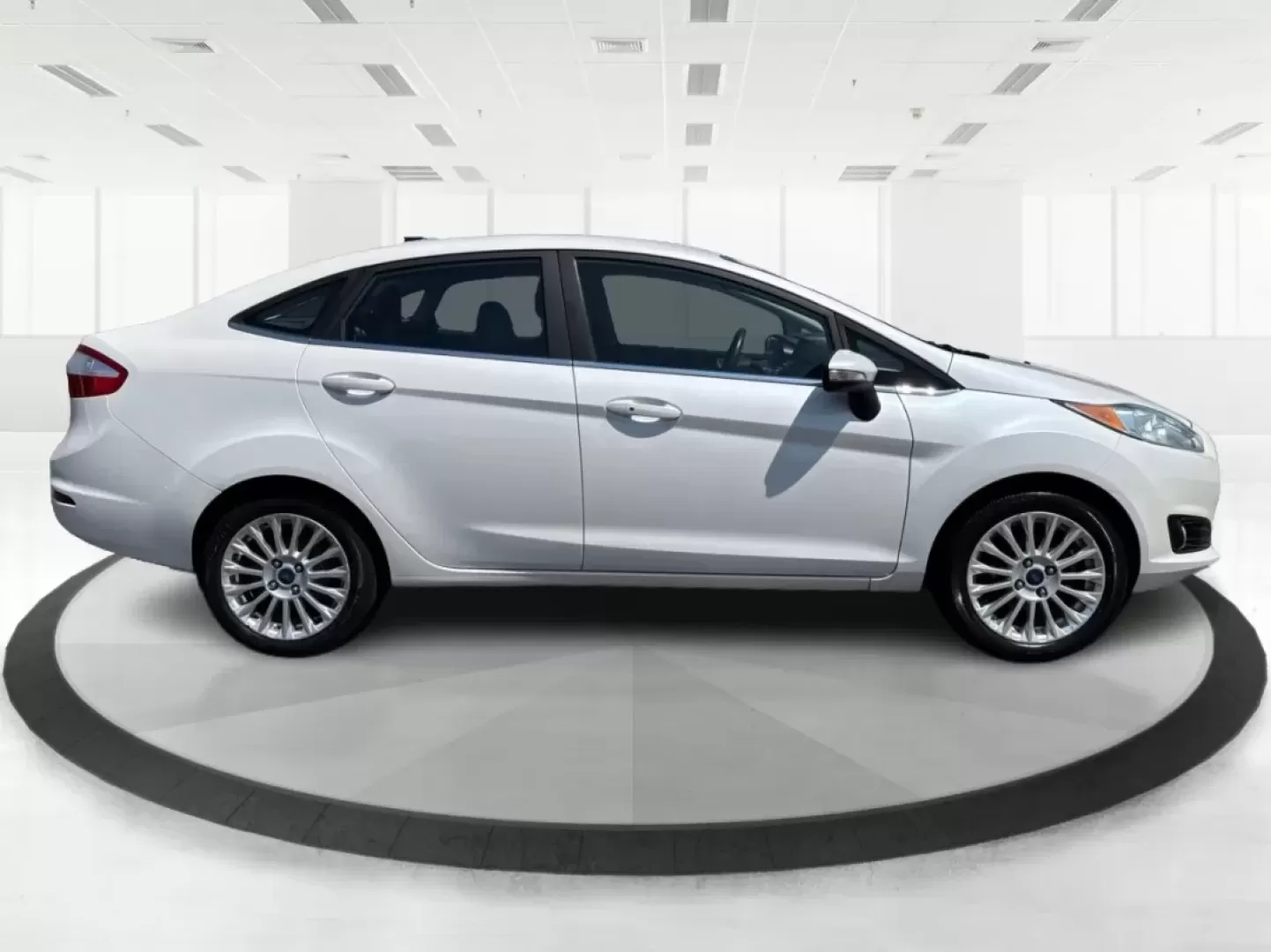 2016 Ford Fiesta Titanium (3FADP4CJ9GM) with an 1.6L I-4 DOHC engine, located at 880 E. National Road, Vandalia, OH, 45377, (937) 908-9800, 39.891918, -84.183594 - **Experience the Ultimate in Style and Comfort with the 2016 Ford Fiesta Titanium Sedan!**<br /> <br /> Are you looking for a stylish yet practical vehicle that fits seamlessly into your daily life? The 2016 Ford Fiesta Titanium Sedan is designed for those who crave sophistication without sacrificin - Photo#1